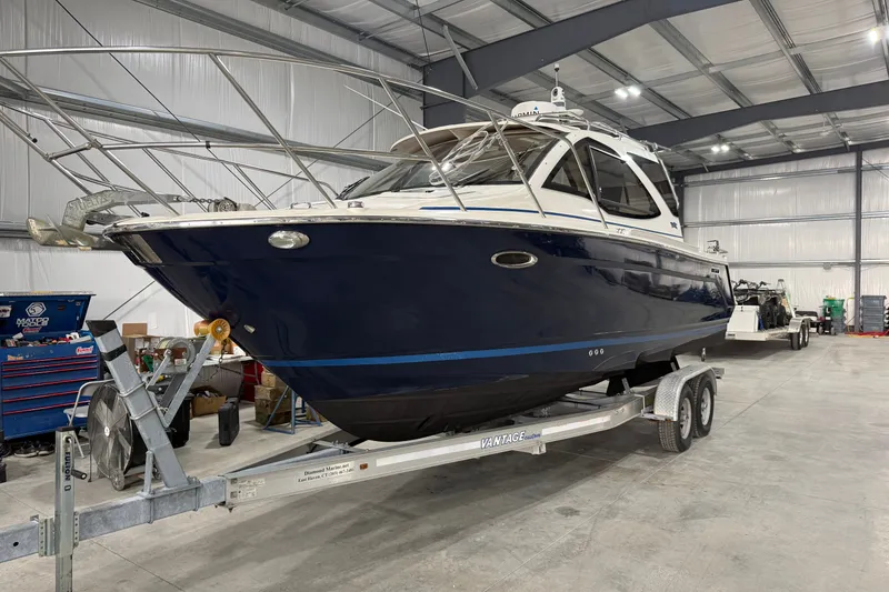 Slide: The Image of 2016 Cutwater C-24 boat on trailer in indoor storage facility. - 1
