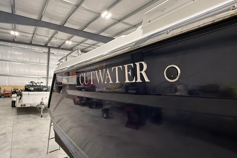 Slide: The Image of 2016 Cutwater C-24 boat in a spacious indoor storage facility. - 5