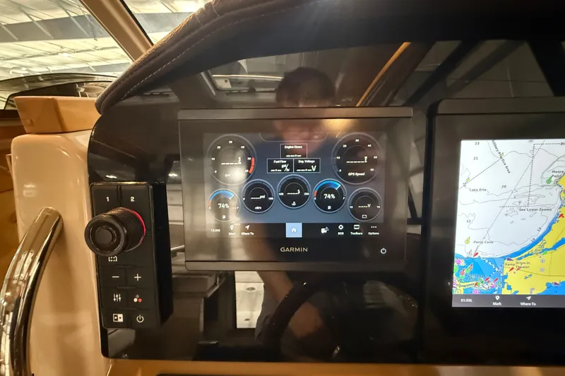 Slide: The Image of Garmin navigation display on 2016 Cutwater C-24 boat, showing engine and map data. - 35