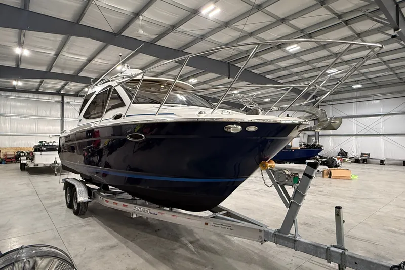 Slide: The Image of 2016 Cutwater C-24 boat on trailer in spacious indoor storage facility. - 4