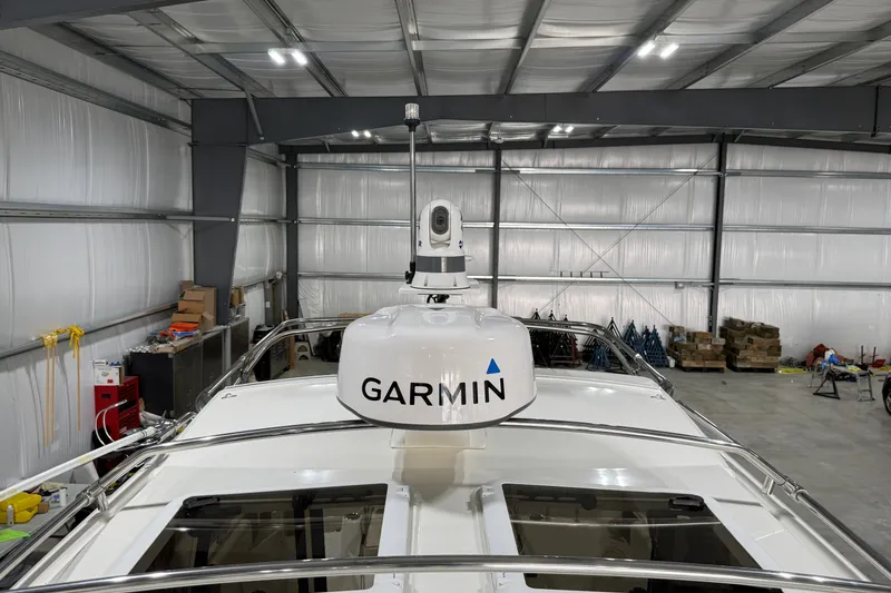 Slide: The Image of 2016 Cutwater C-24 boat with Garmin radar in a spacious indoor storage facility. - 11