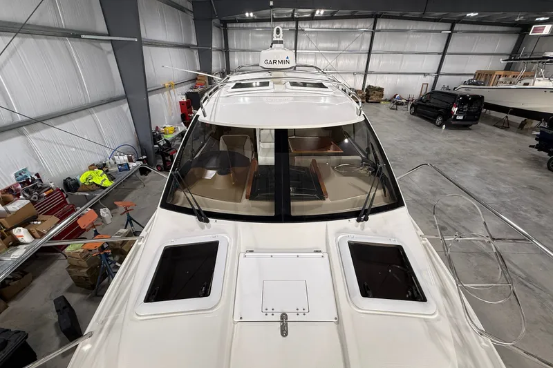Slide: The Image of 2016 Cutwater C-24 boat in a spacious indoor storage facility. - 10