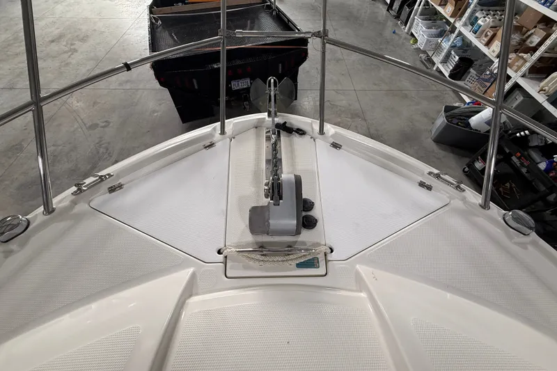 Slide: The Image of Bow view of a 2016 Cutwater C-24 boat in a storage area. - 9