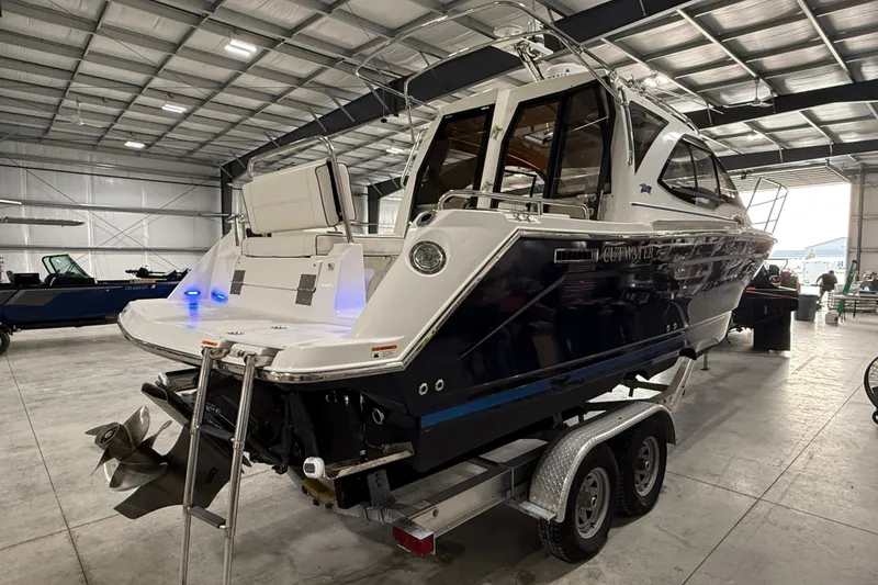 Slide: The Image of 2016 Cutwater C-24 boat on trailer in indoor storage facility. - 2