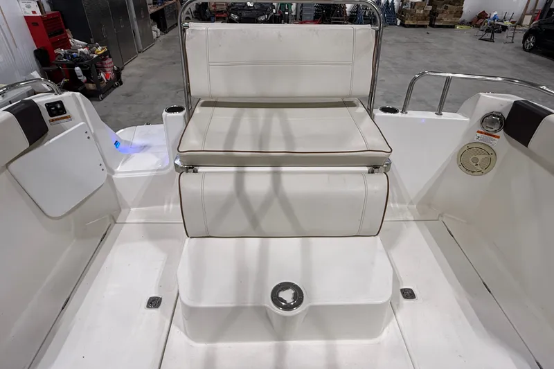 Slide: The Image of 2016 Cutwater C-24 boat interior with white seating and stainless steel accents. - 15