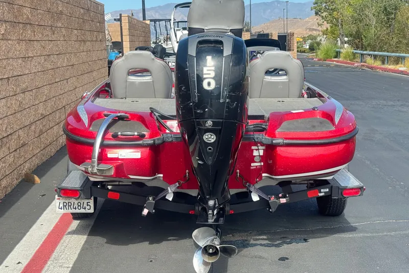 Slide: The Image of Red 2018 Nitro Z18 boat with Mercury 150 engine on a trailer. - 4