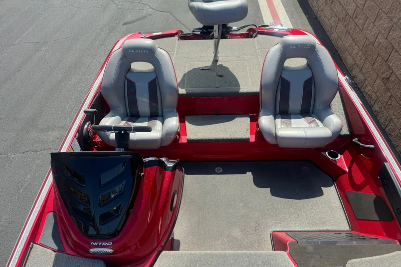 Slide: The Image of 2018 Nitro Z18 boat interior with dual seats and steering console. - 14