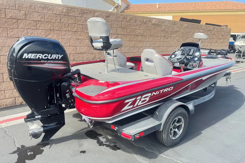 Slide: The Image of Red 2018 Nitro Z18 boat with Mercury FourStroke engine on trailer. - 5
