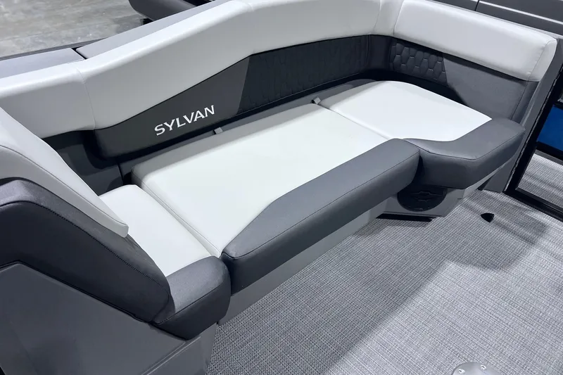 Slide: The Image of Luxurious seating in the 2026 Sylvan R-22 CLZ DH boat, featuring sleek gray and white upholstery. - 5