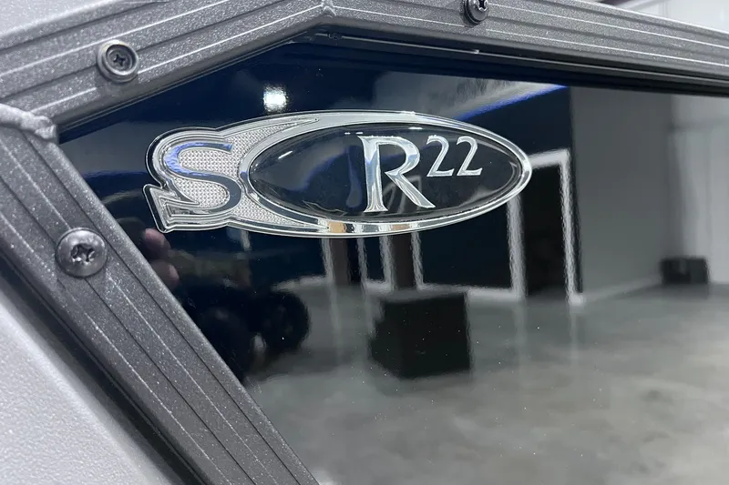 Slide: The Image of Close-up of Sylvan R-22 CLZ DH 2026 model emblem on a sleek surface. - 16