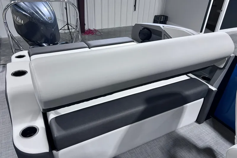 Slide: The Image of 2026 Sylvan R-22 CLZ DH boat interior with Yamaha engine, featuring sleek seating and cup holders. - 10