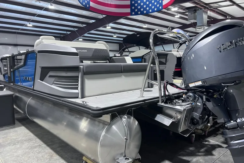 Slide: The Image of 2026 Sylvan R-22 CLZ DH pontoon boat with Yamaha engine in showroom. - 2