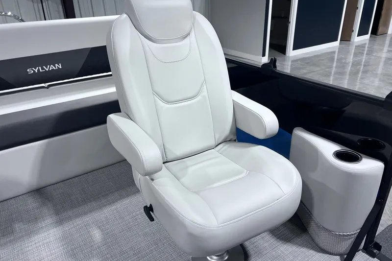 Slide: The Image of Luxurious white captain's chair in 2026 Sylvan R-22 CLZ DH boat interior. - 8