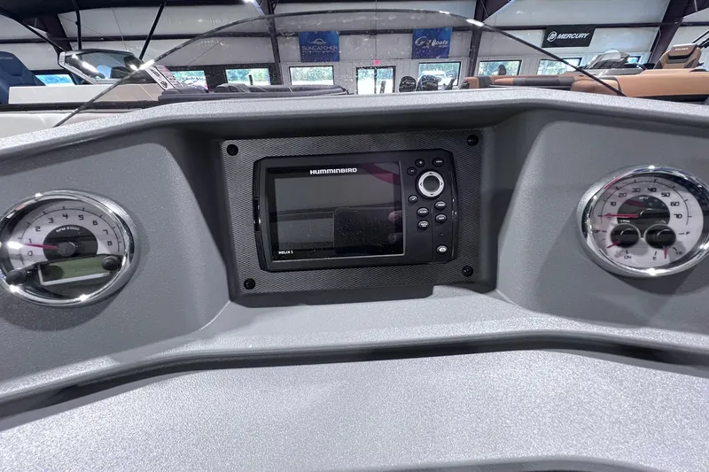 Slide: The Image of Dashboard of 2026 Sylvan R-22 CLZ DH boat with gauges and Humminbird Helix 5 display. - 13