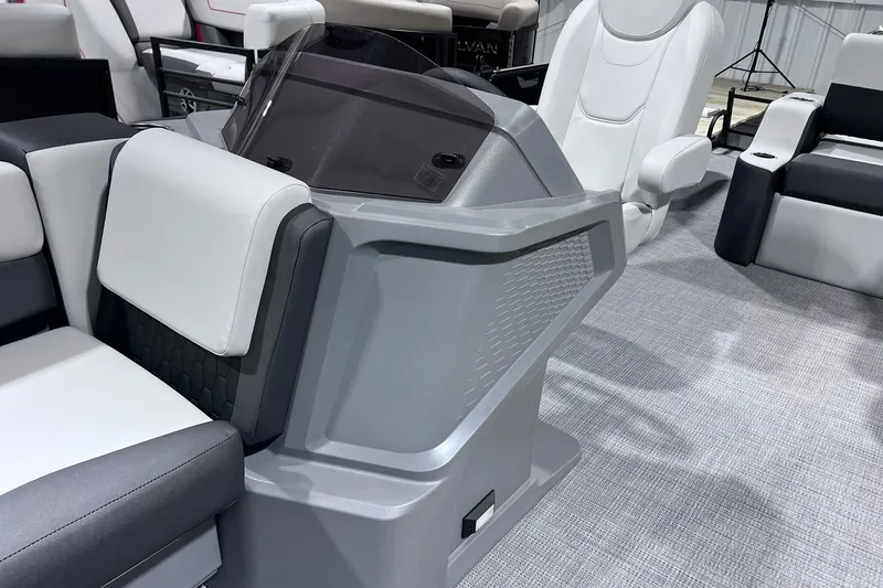Slide: The Image of Interior of 2026 Sylvan R-22 CLZ DH boat with modern seating and helm design. - 7