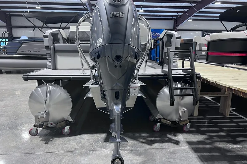 Slide: The Image of 2026 Sylvan R-22 CLZ DH pontoon boat with 150 HP engine in showroom. - 3