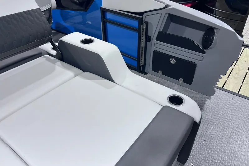 Slide: The Image of 2026 Sylvan R-22 CLZ DH boat interior with seating and storage compartments. - 12
