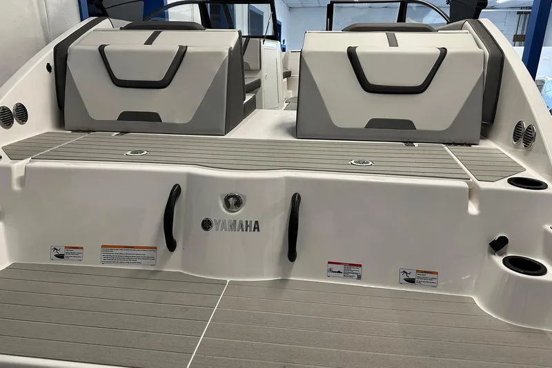 Slide: The Image of 2026 Yamaha Boats AR220 rear deck with seating and storage compartments. - 3