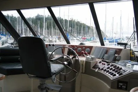 Slide: The Image of Pilot house interior of 2000 Bayliner 4788 Motoryacht with marina view. - 5