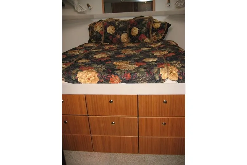 Slide: The Image of Cozy bedroom with floral bedding in 2000 Bayliner 4788 Pilot House Motoryacht. - 7