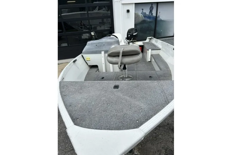 Slide: The Image of 2010 Alumacraft Fisherman 160 CS boat with seating and carpeted deck. - 3