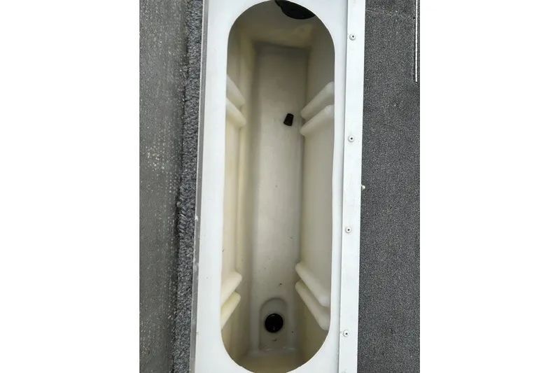 Slide: The Image of Interior storage compartment of 2010 Alumacraft Fisherman 160 CS boat. - 15