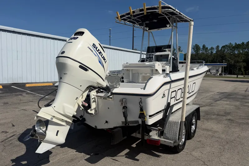 Slide: The Image of 1999 Robalo 2120 Center Console boat with Suzuki outboard motor on trailer. - 8