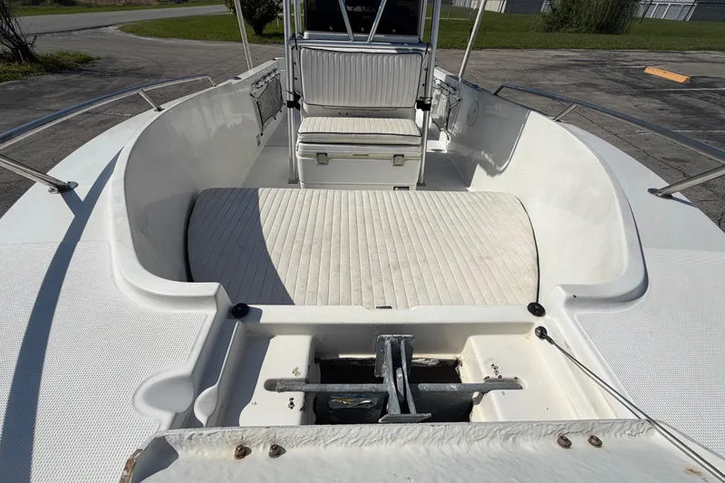 Slide: The Image of 1999 Robalo 2120 Center Console boat interior with seating and anchor storage. - 19