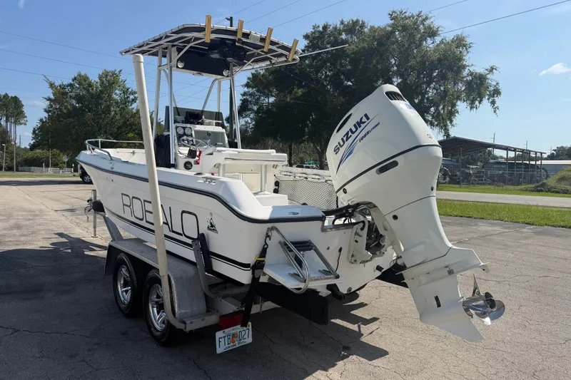 Slide: The Image of 1999 Robalo 2120 Center Console boat with Suzuki outboard motor on trailer. - 6