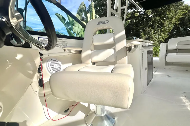 Slide: The Image of 2015 Boston Whaler 270 Vantage boat interior with steering wheel and seating. - 62
