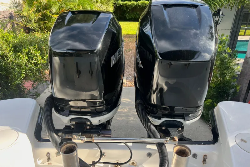 Slide: The Image of Twin Mercury outboard engines on a 2015 Boston Whaler 270 Vantage boat. - 47