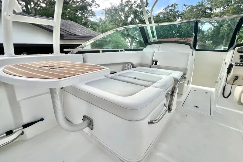 Slide: The Image of 2015 Boston Whaler 270 Vantage interior with seating and table, showcasing luxury and comfort. - 95