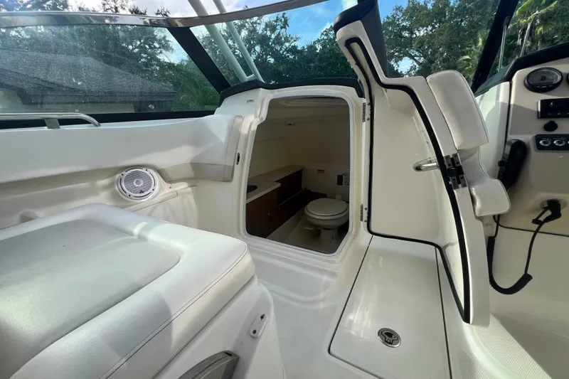 Slide: The Image of Interior view of 2015 Boston Whaler 270 Vantage boat with cabin and seating. - 82
