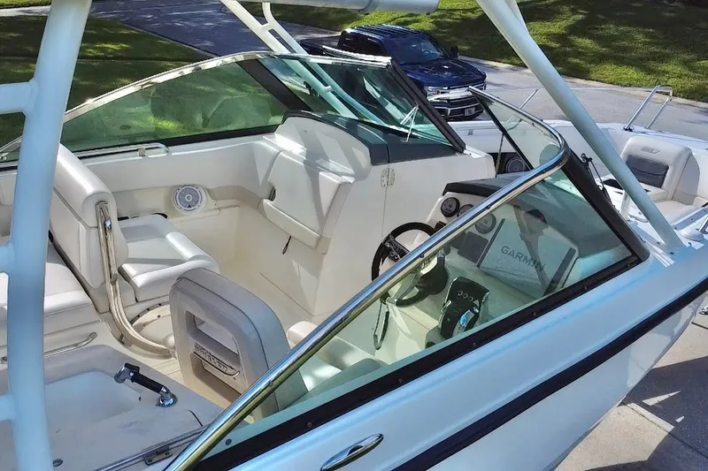 Slide: The Image of 2015 Boston Whaler 270 Vantage boat interior with seating and steering console. - 38
