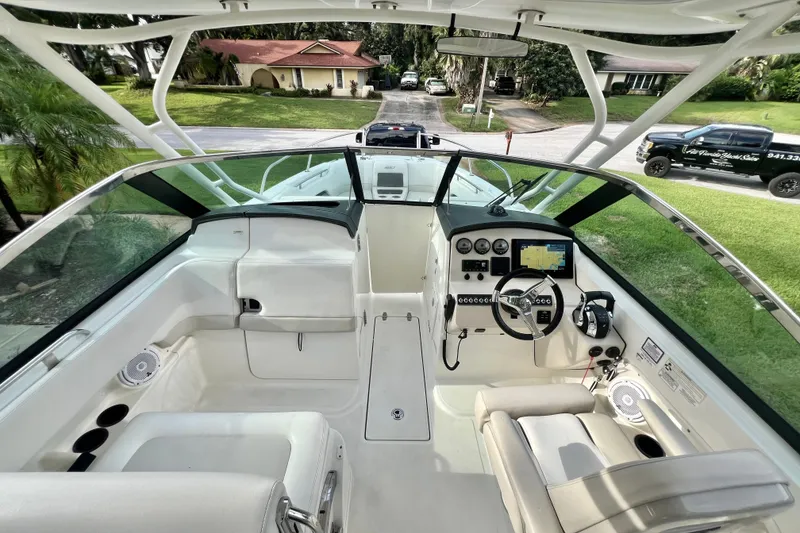 Slide: The Image of 2015 Boston Whaler 270 Vantage boat interior with modern dashboard and steering wheel. - 76