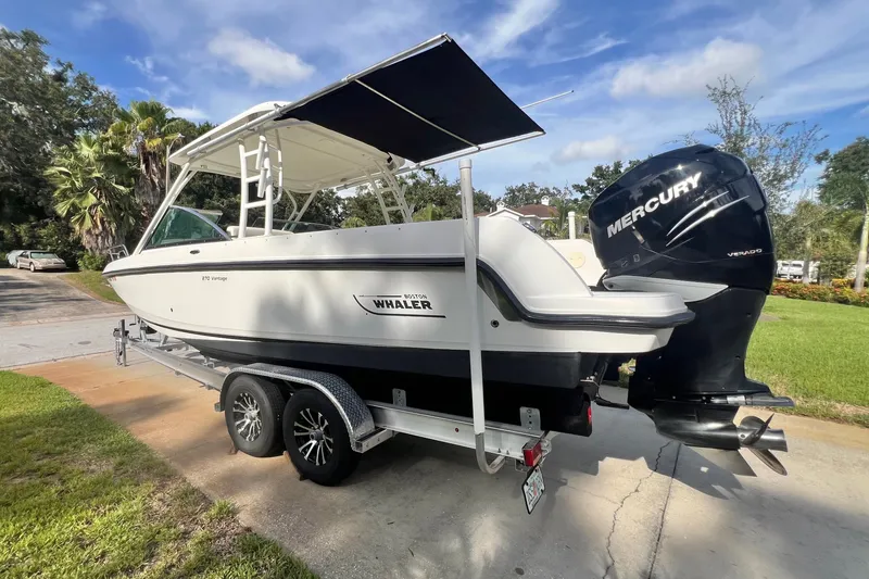 Slide: The Image of 2015 Boston Whaler 270 Vantage boat on trailer with Mercury engine. - 17