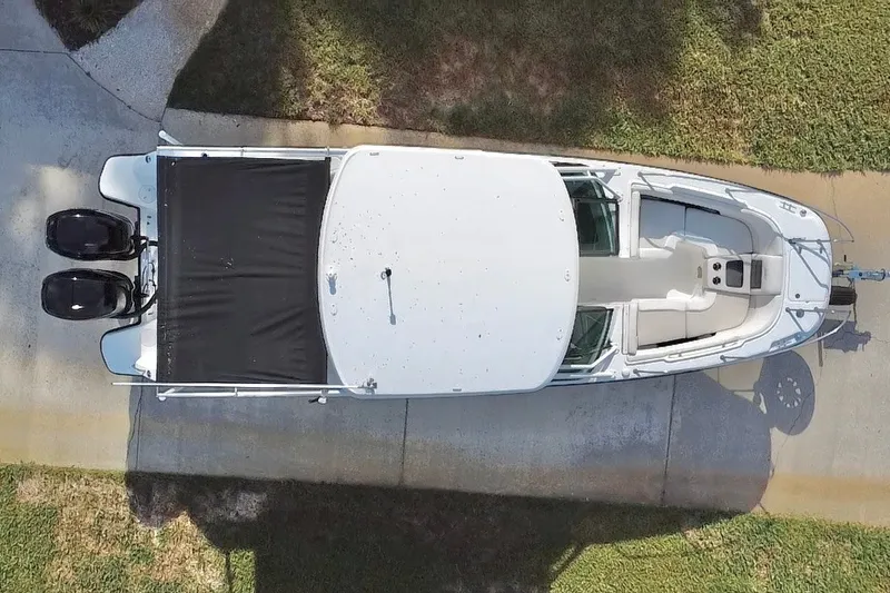 Slide: The Image of Overhead view of a 2015 Boston Whaler 270 Vantage boat on a driveway. - 31