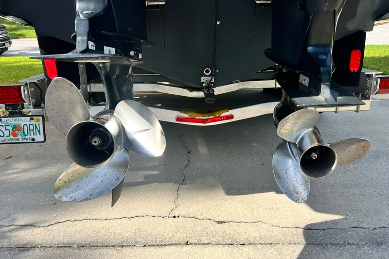 Slide: The Image of Twin propellers of a 2015 Boston Whaler 270 Vantage boat on a trailer. - 12
