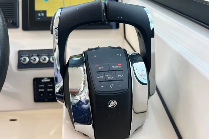 Slide: The Image of Close-up of 2015 Boston Whaler 270 Vantage throttle controls in cockpit. - 78