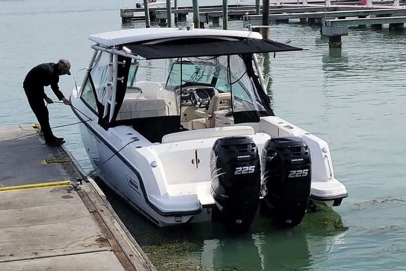 Slide: The Image of 2015 Boston Whaler 270 Vantage docked with dual Mercury 225 engines. - 6