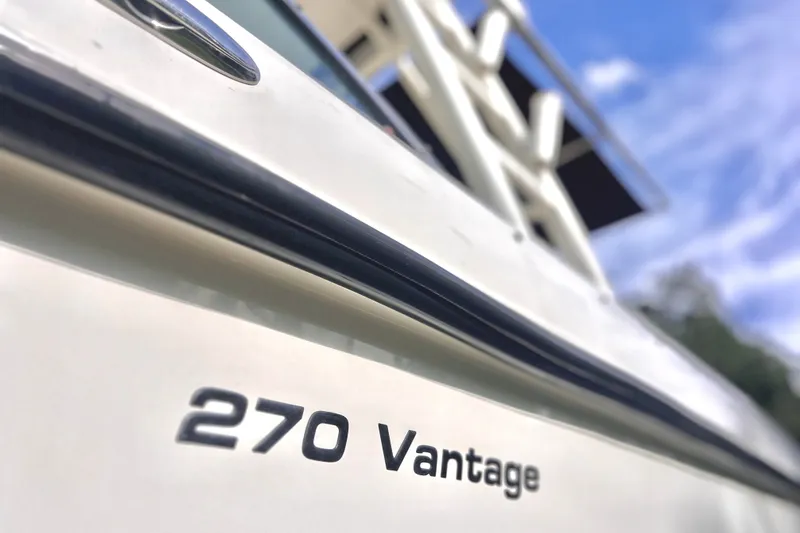 Slide: The Image of 2015 Boston Whaler 270 Vantage boat close-up with clear sky background. - 24