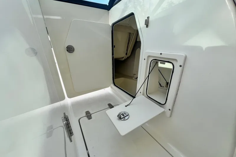 Slide: The Image of 2015 Boston Whaler 270 Vantage storage compartments, showcasing interior access and functionality. - 72
