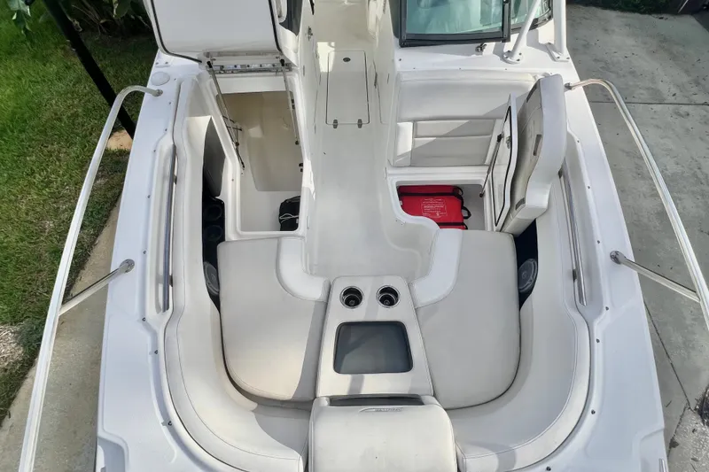 Slide: The Image of 2015 Boston Whaler 270 Vantage boat interior with seating and storage compartments. - 69