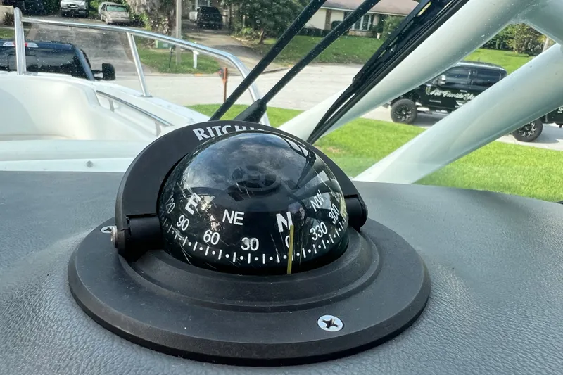 Slide: The Image of Compass on 2015 Boston Whaler 270 Vantage boat dashboard, showing navigation details. - 74