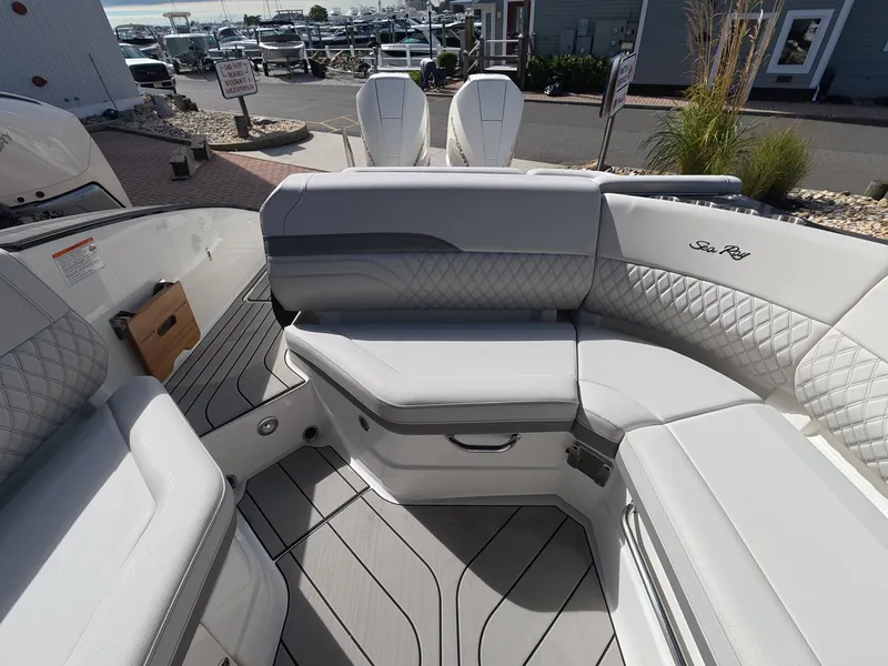 Slide: The Image of The image shows the luxurious cockpit of a 2027 Sea Ray SLX 280 Outboard with elegant, cushioned seating. - 6
