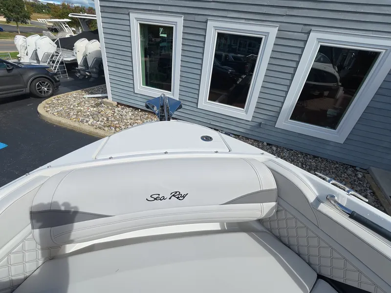 Slide: The Image of The image shows the bow of a Sea Ray SLX 280 Outboard boat with white upholstery. - 21