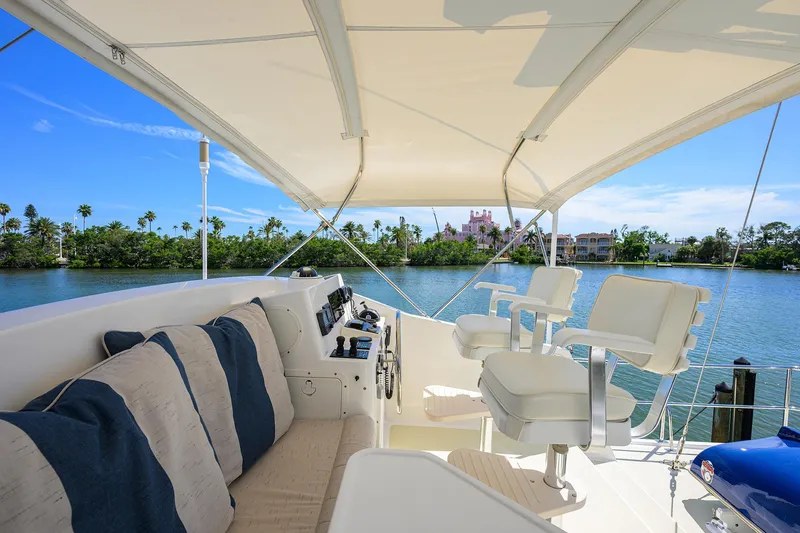 Slide: The Image of Luxurious 2013 Krogen 44' AE Widebody yacht interior with plush seating and scenic water view. - 38