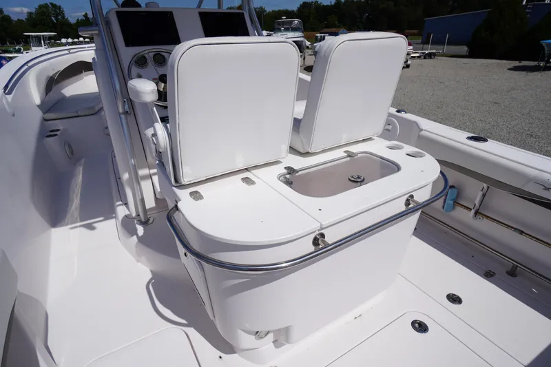 Slide: The Image of 2016 Pro-Line 29 Grand Sport boat interior with dual seats and control panel. - 38