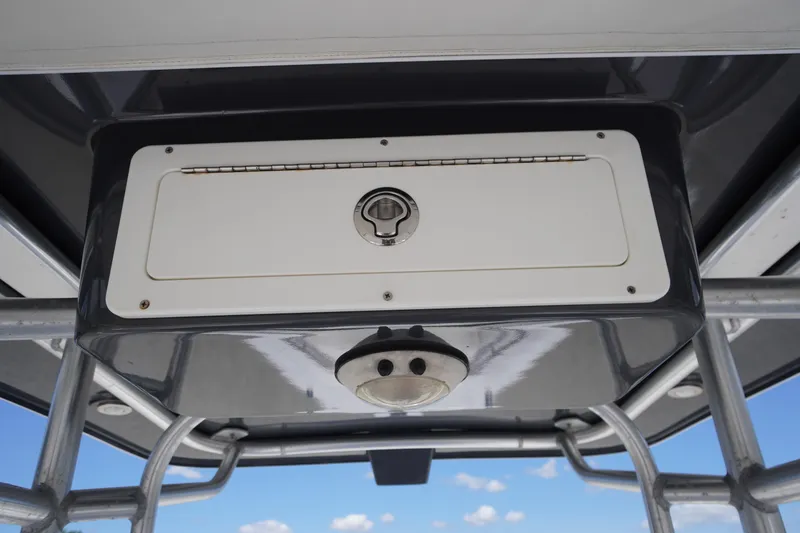 Slide: The Image of 2016 Pro-Line 29 Grand Sport boat console with storage compartment and latch. - 4