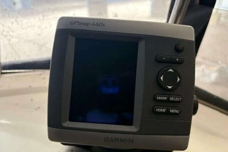 Slide: The Image of Garmin GPSmap 440s device on a 1991 Carver 3067 Santego boat dashboard. - 15